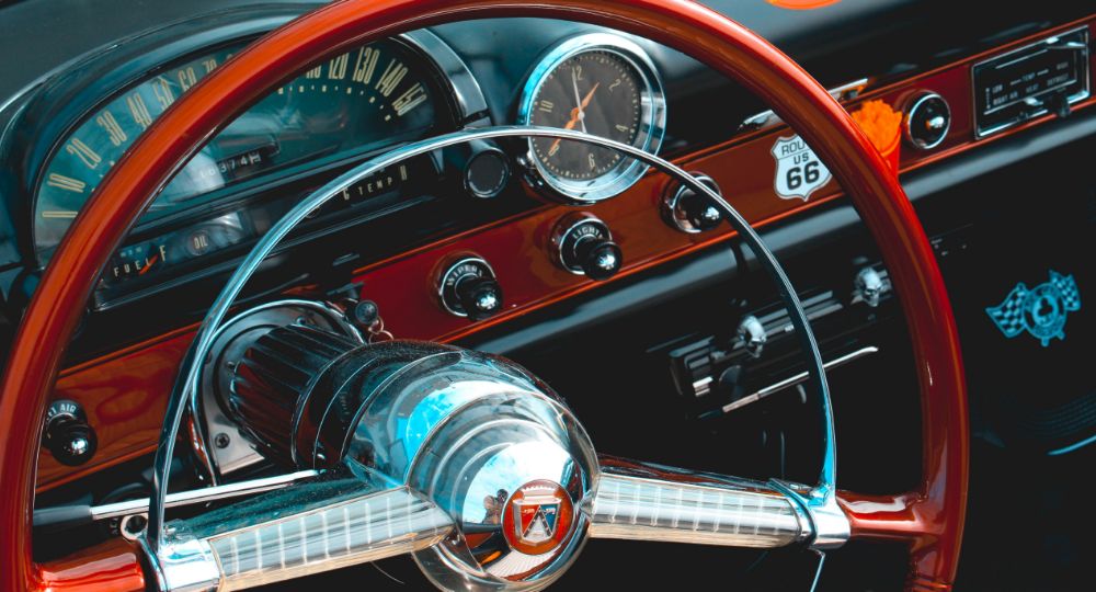 Close-up shot of the dashboard of a classic American car