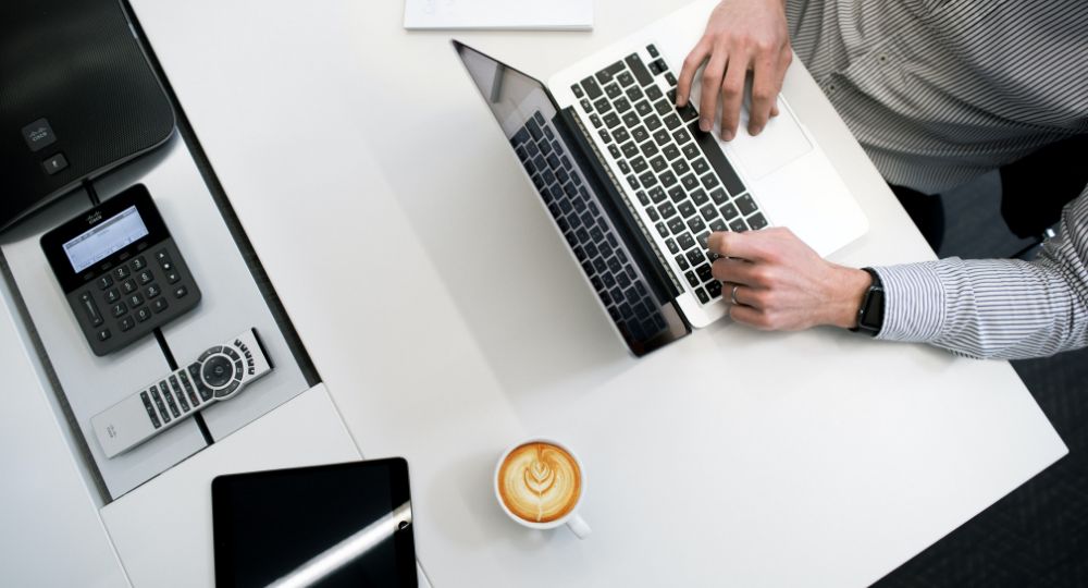 Aerial shot of person typing on laptop