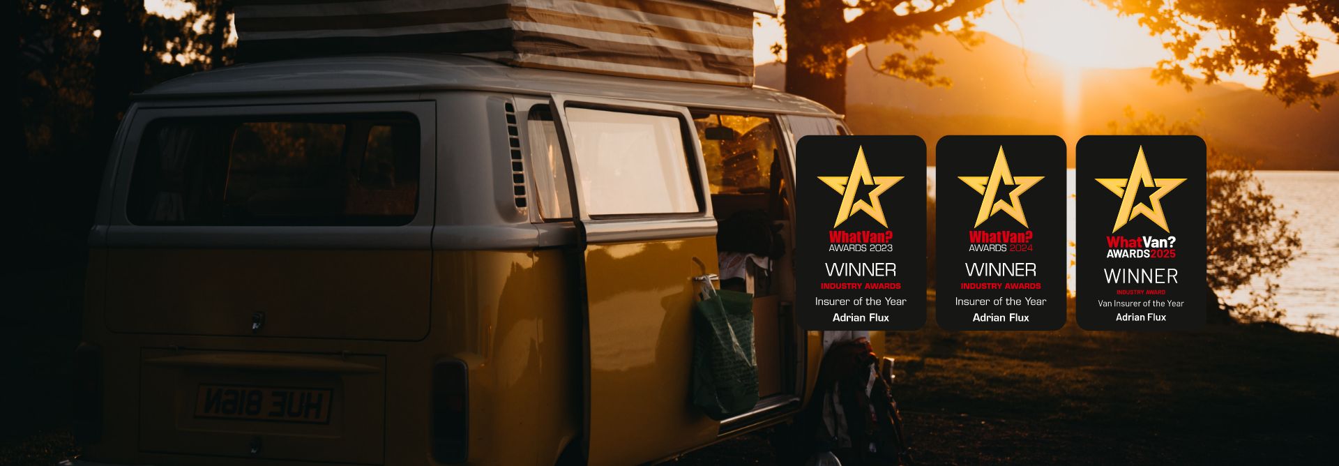 Campervan by the side of a lake at golden hour