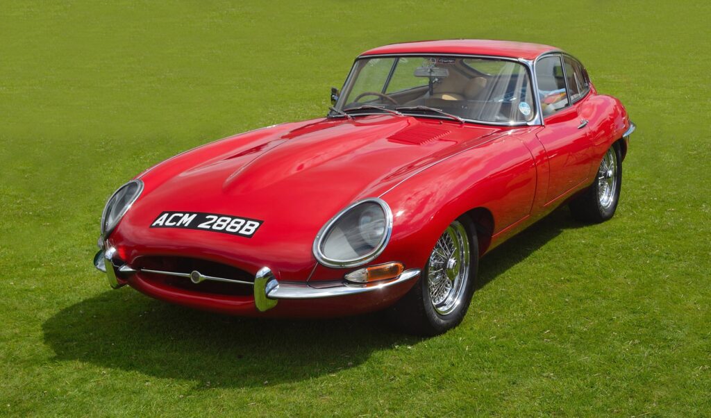 Classic Red E - Type Jaguar in vintage car Show.