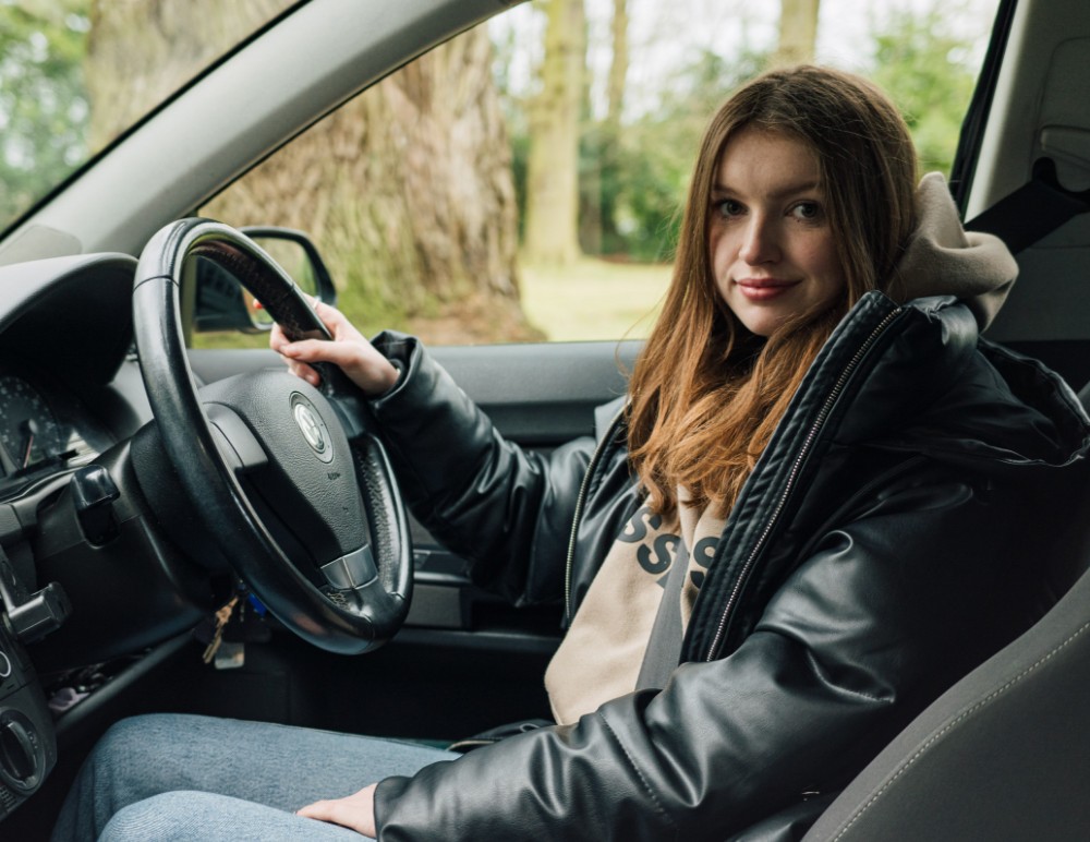 VW camper parked in green area