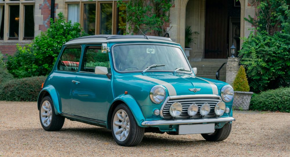 Blue Classic Mini Parked in front of house