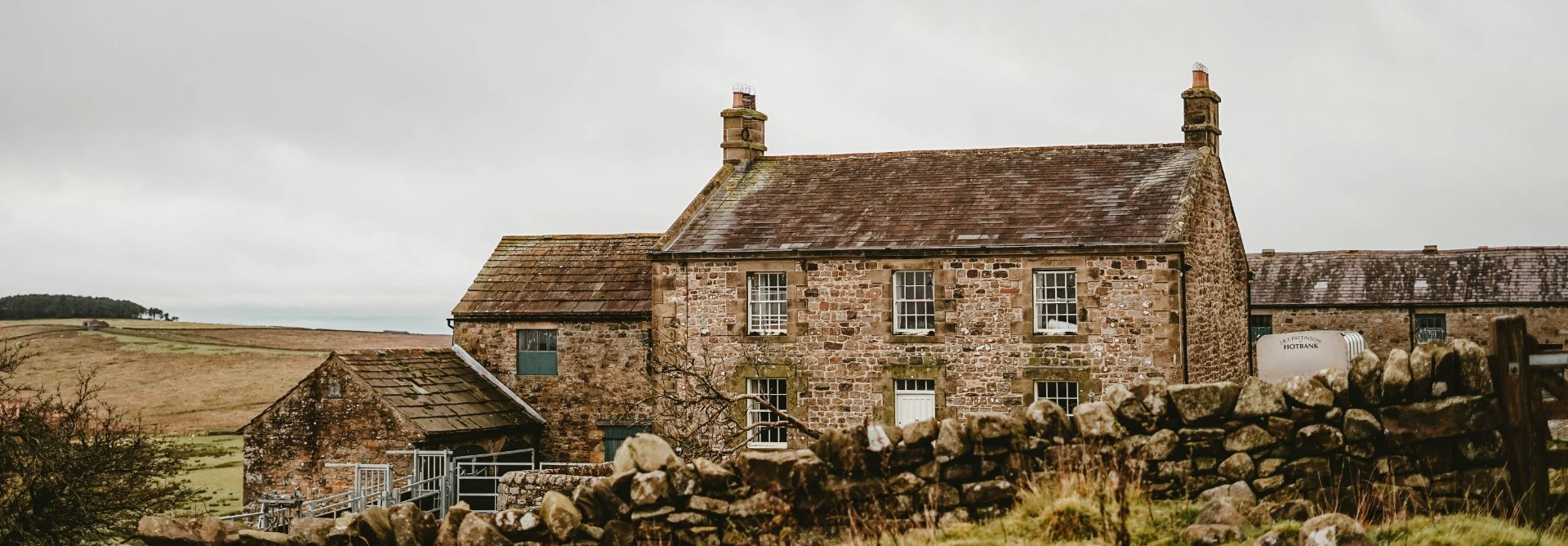 Cottage in countryside on a grey cloudy day
