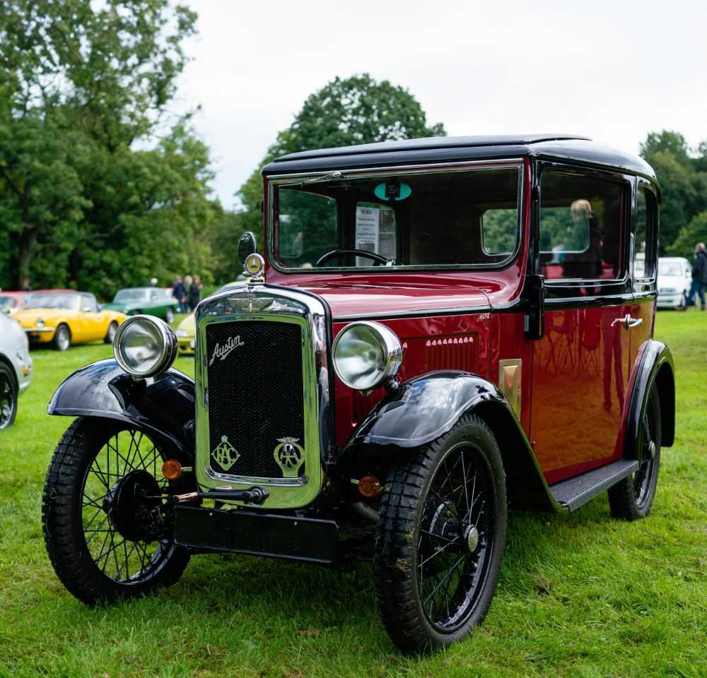 Red Austin 7 at a car show
