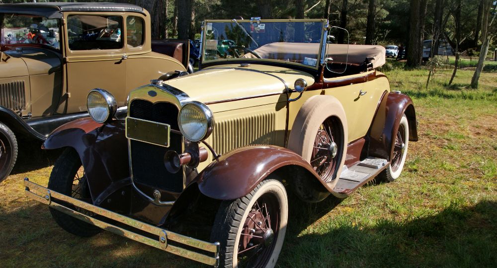 Ford Model A in a field during a car show