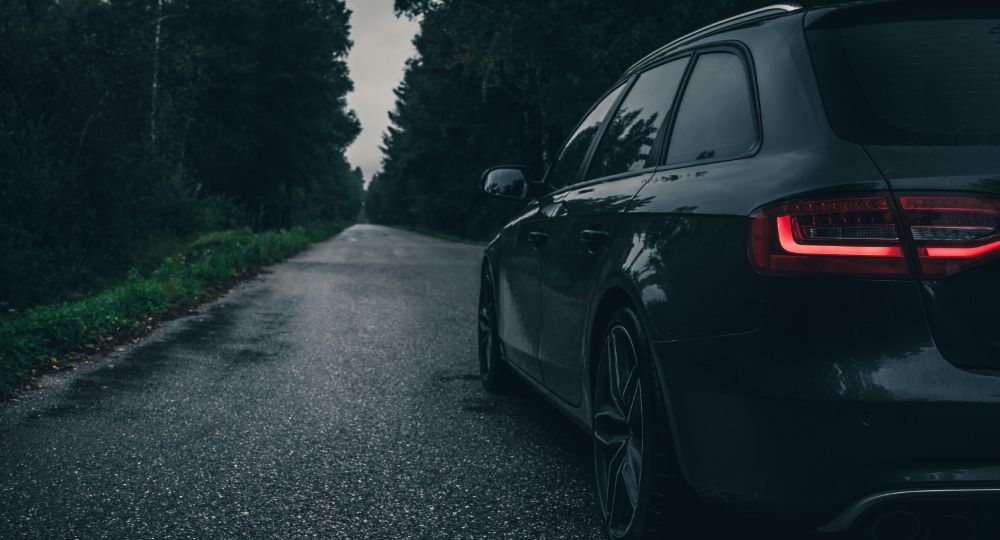Audi car driving down the road