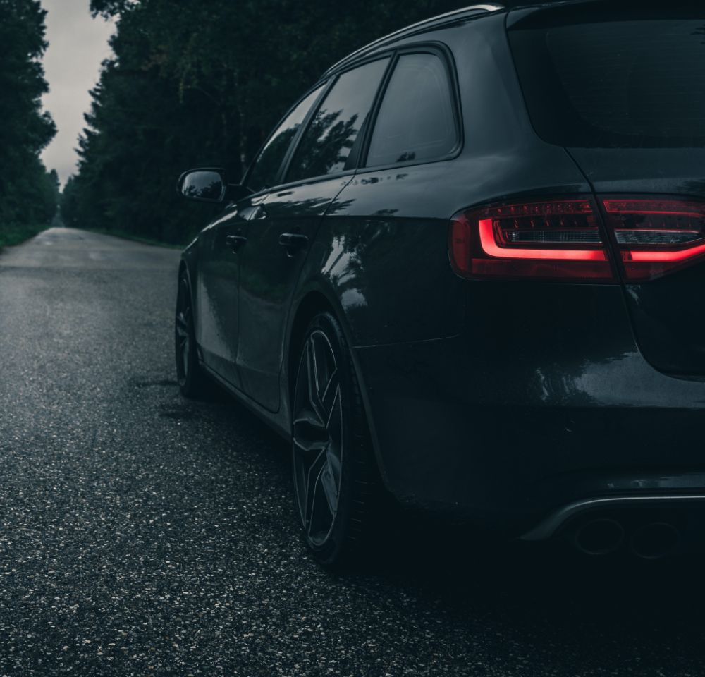 Audi car driving down the road