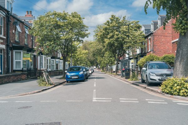 UK road with cars parked on either side