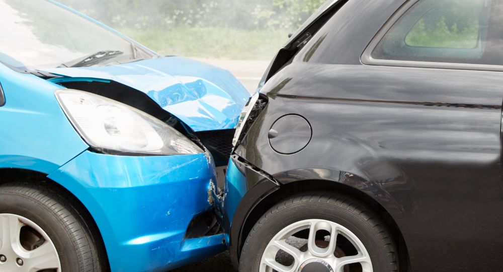 blue and black car involved in a crash