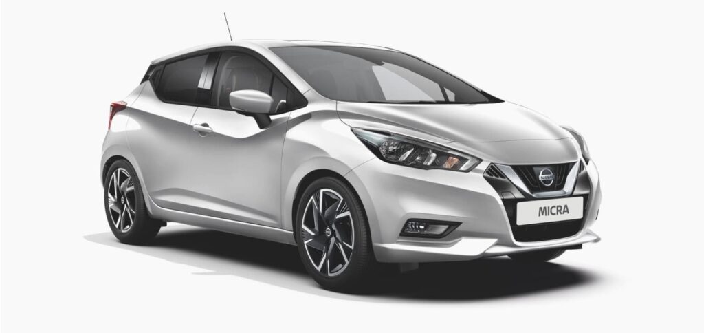 Silver Nissan Micra on white background