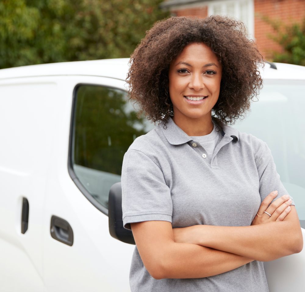 Woman standing in front of a white van