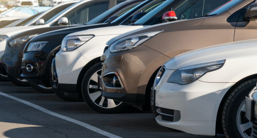 Cars lined up in car park