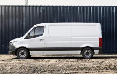 White van parked in front of building