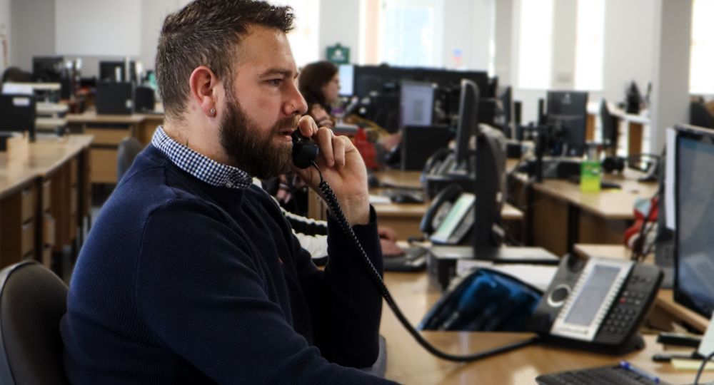 Man on phone in call centre