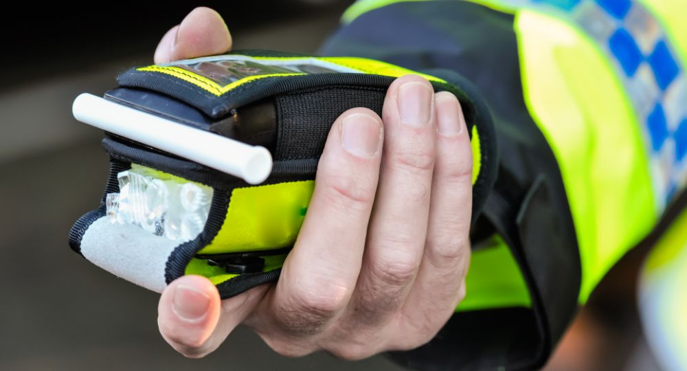 Officer holding out a breathalyser