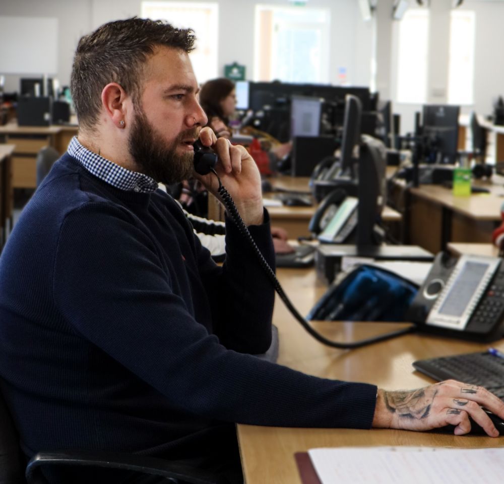 Man on phone in call centre
