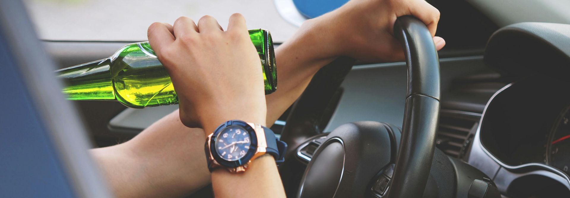 Man drinking while driving