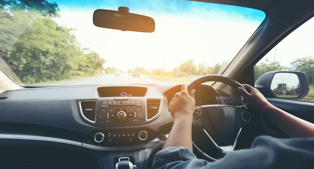 Car interior with someone driving
