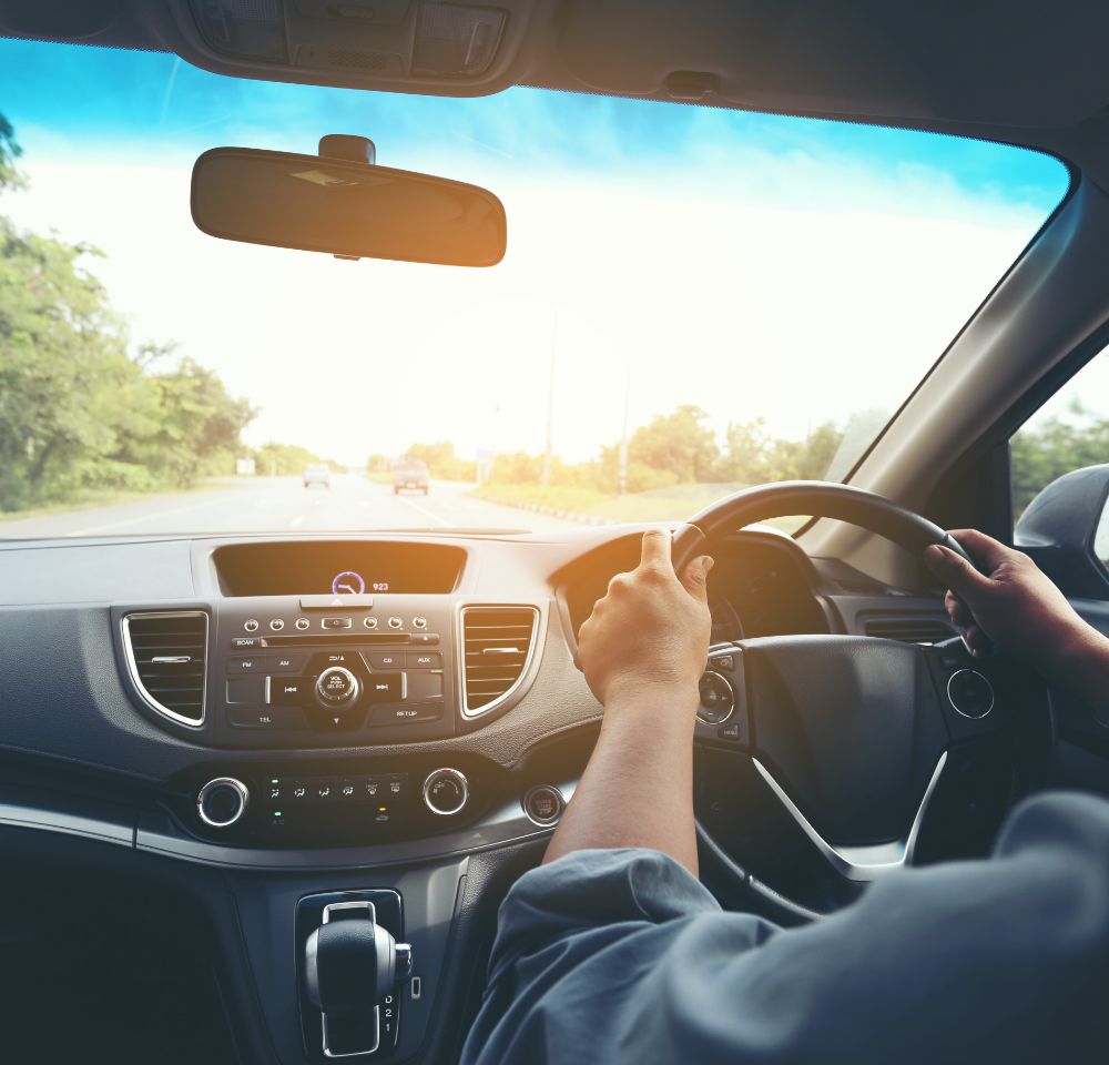 Car interior with someone driving