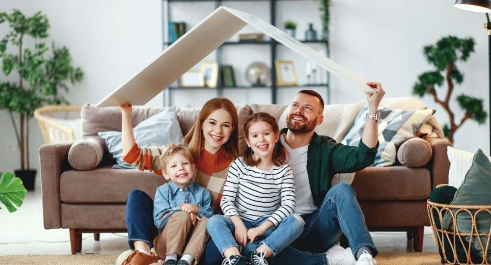 Family holding up a roof in their living room