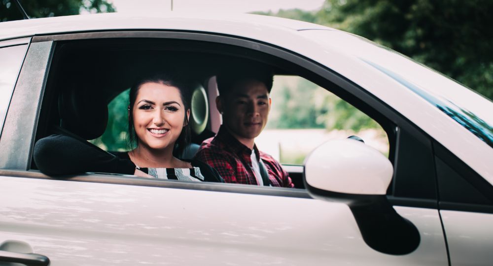 Two young drivers in car