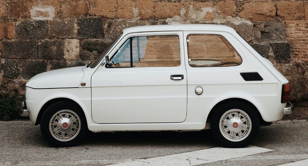 Small Fiat parked on the road