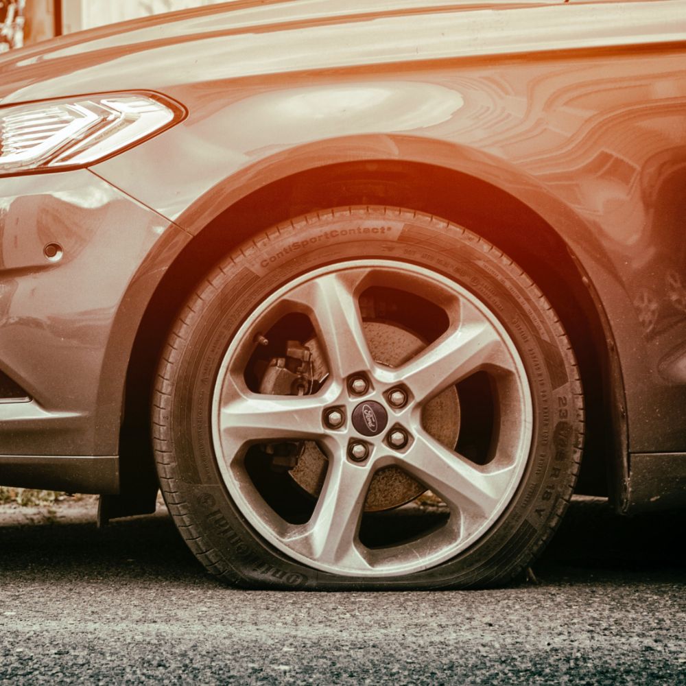 Car with a flat tyre 