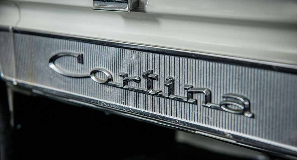 Close-up shot of Ford Cortina logo