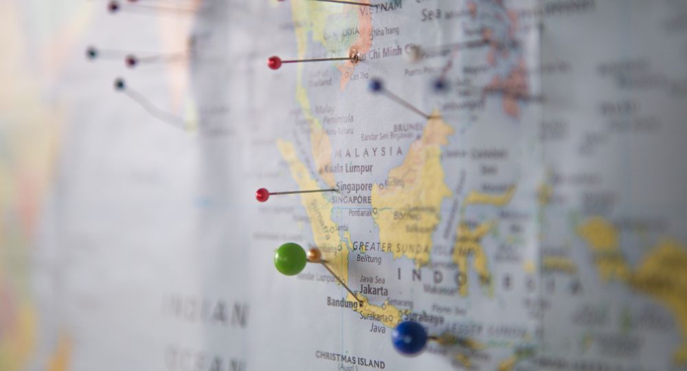 World map with pins in it