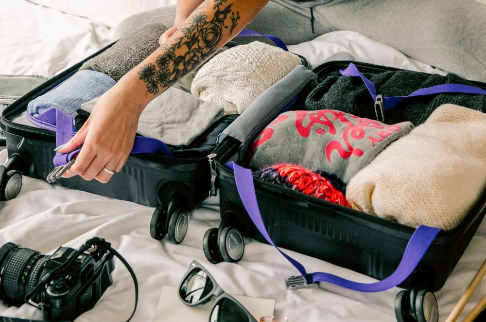 Woman packing suitcase