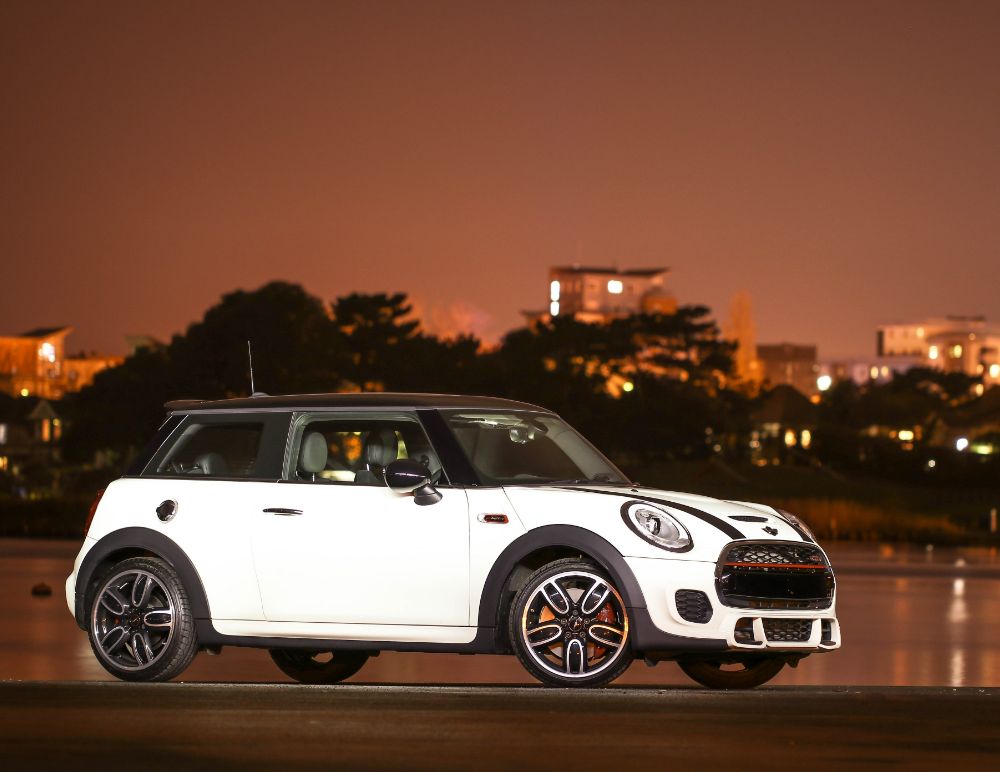 Mini Cooper s outside city at night