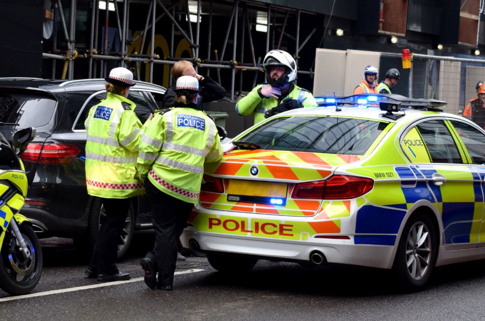 Police around a vehicle