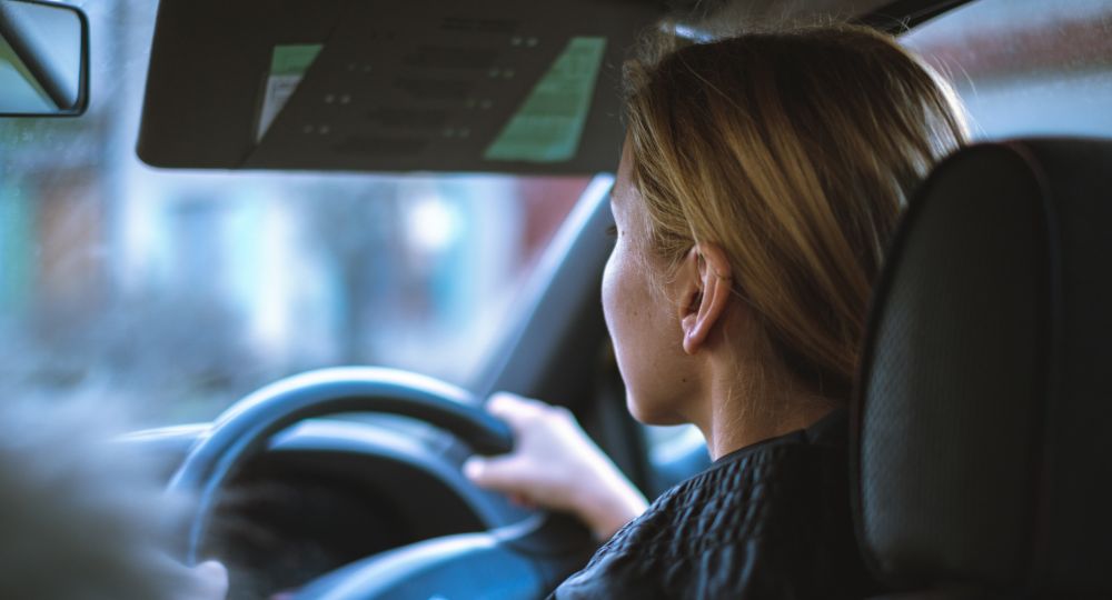 Woman holding the steering wheel