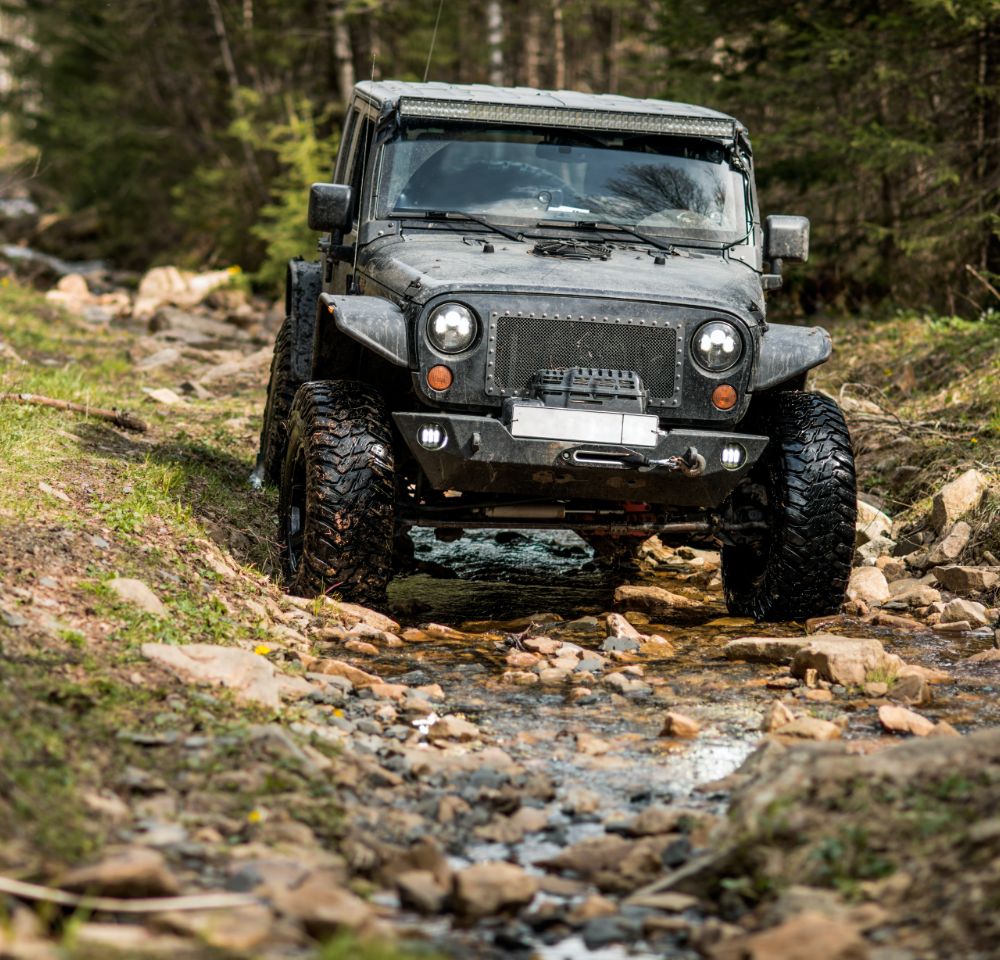 Jeep off-roading on rocky terrain