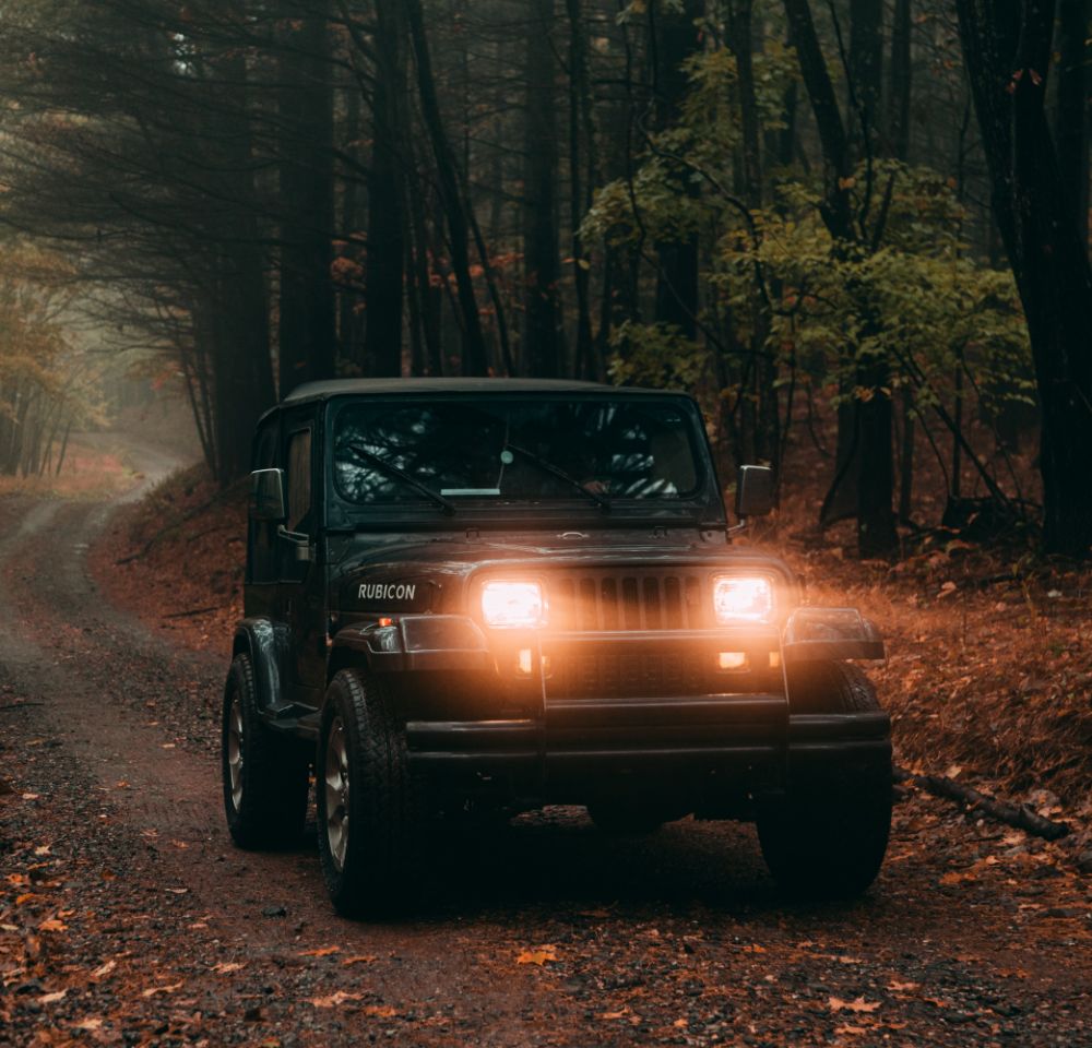 Black Jeep going down road