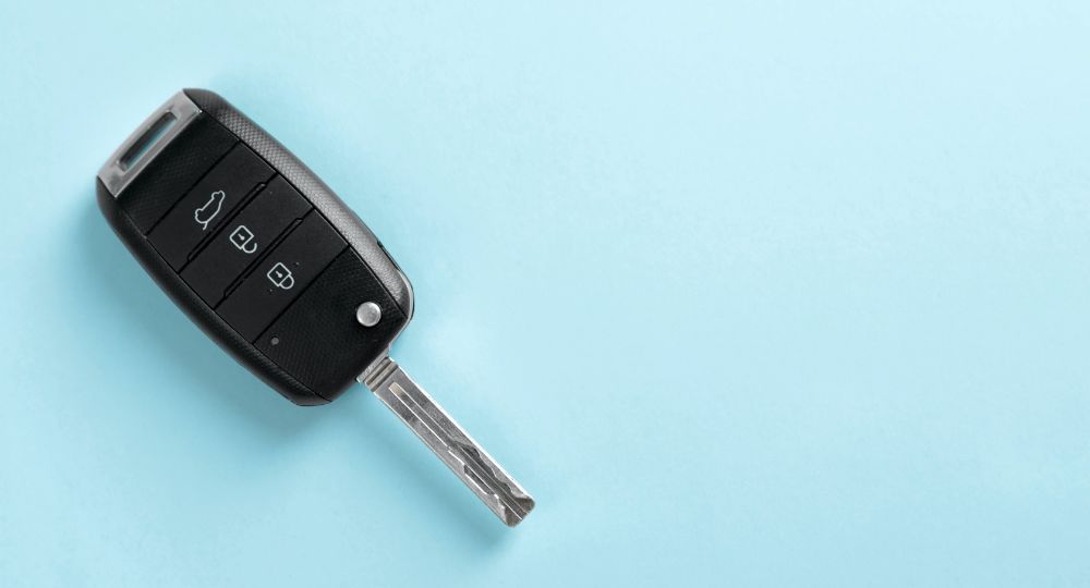 Car key on blue background