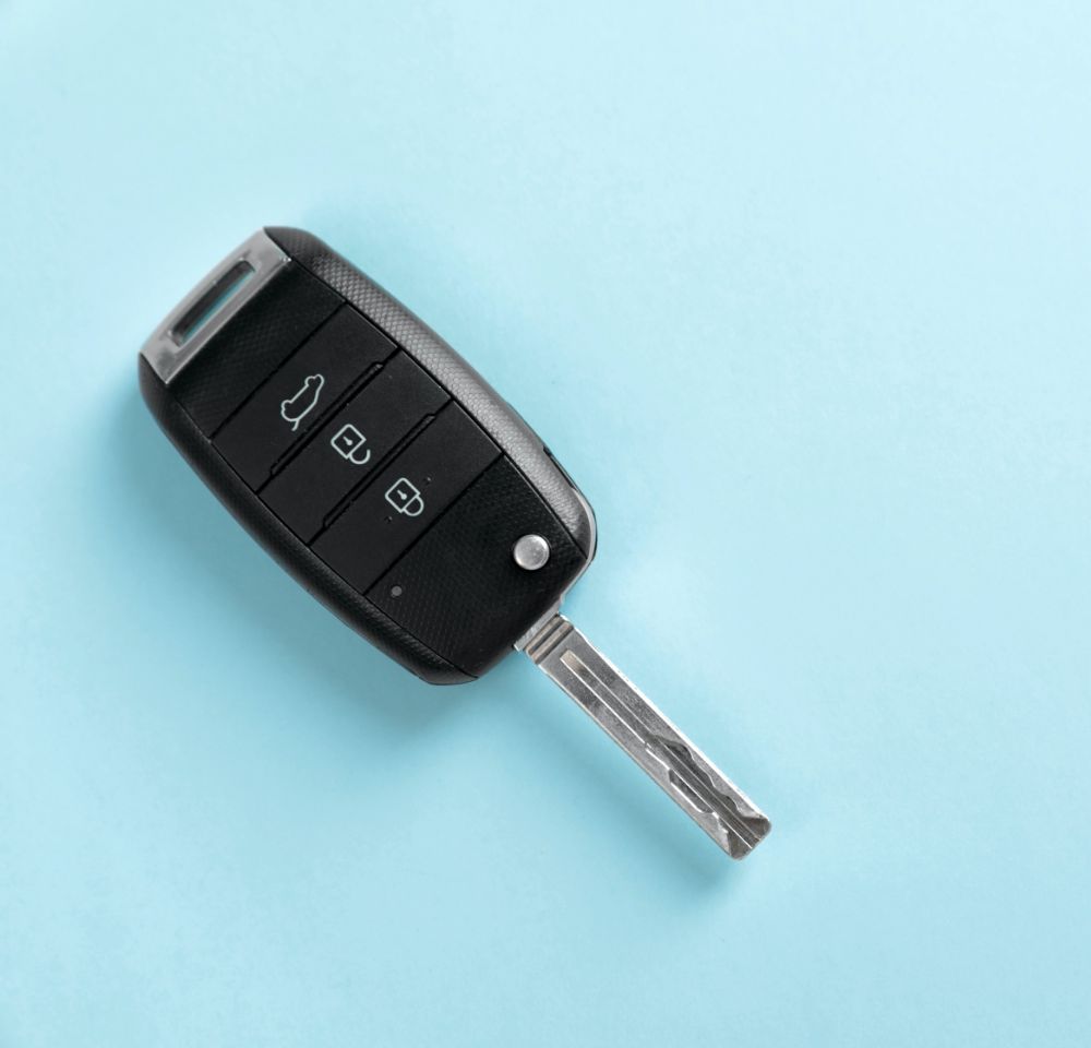 Car key on blue background