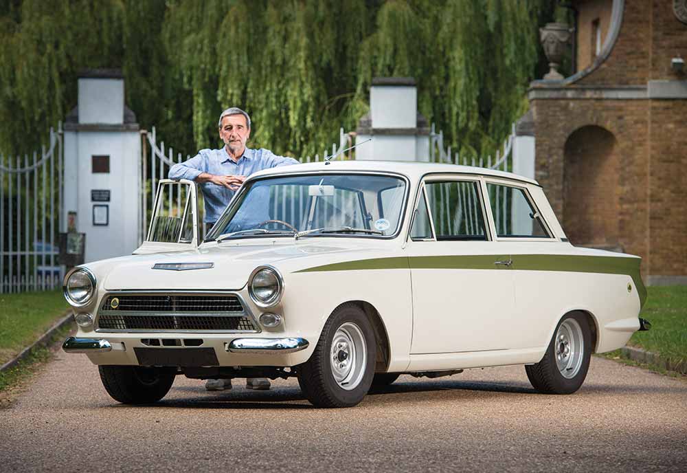 Person standing next to Lotus car