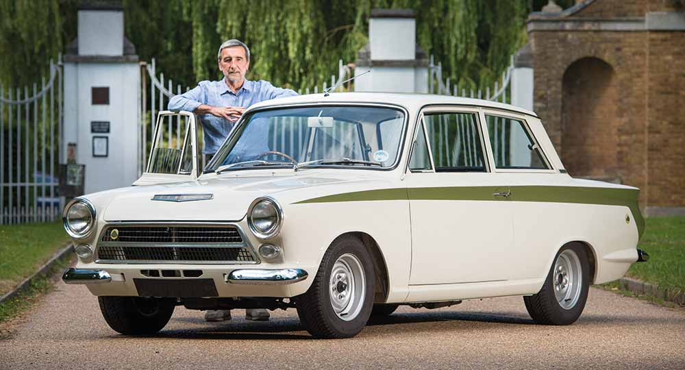 Person standing next to Lotus car
