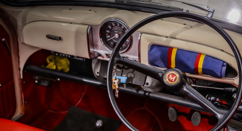 Morris Minor dashboard interior on show, including wheel