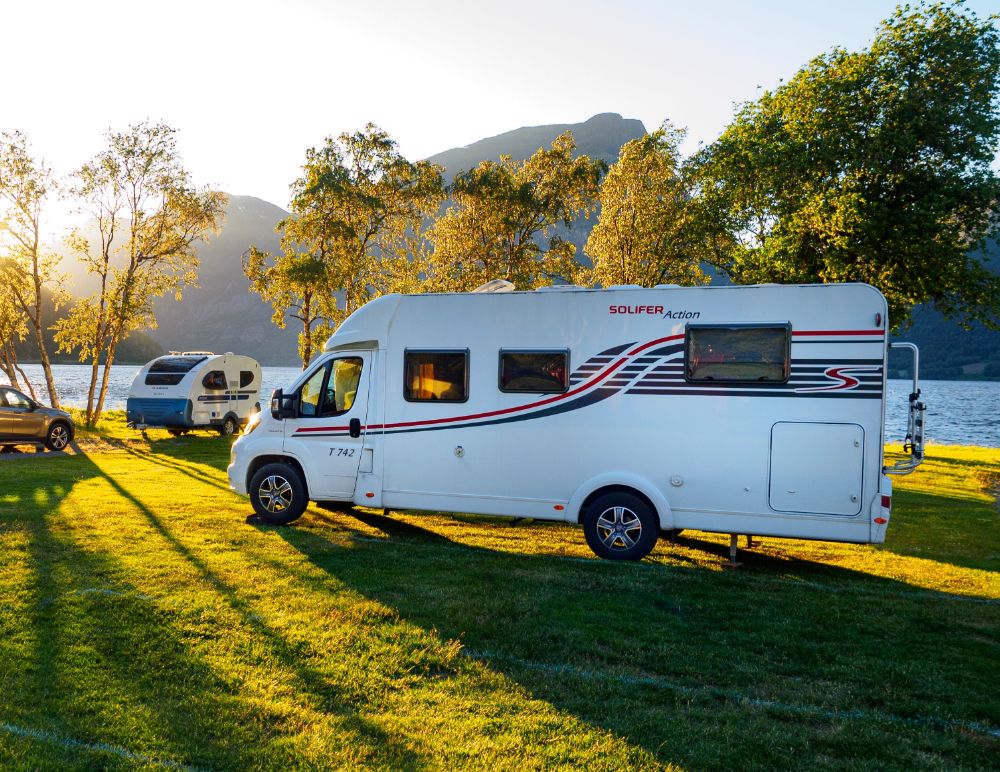 Motorhome parked on grass in the sun