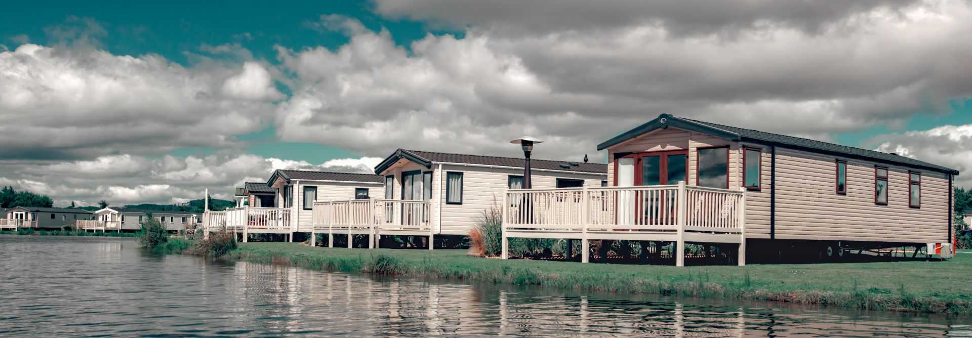Static caravans next to a lake
