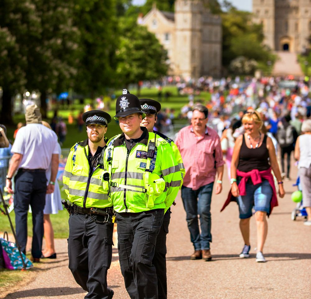 Police patrolling the street on a sunny day