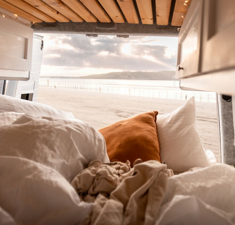 inside of a converted van at the beach