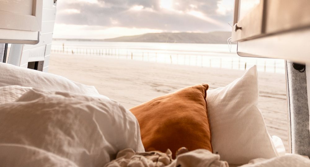 inside of a converted van at the beach