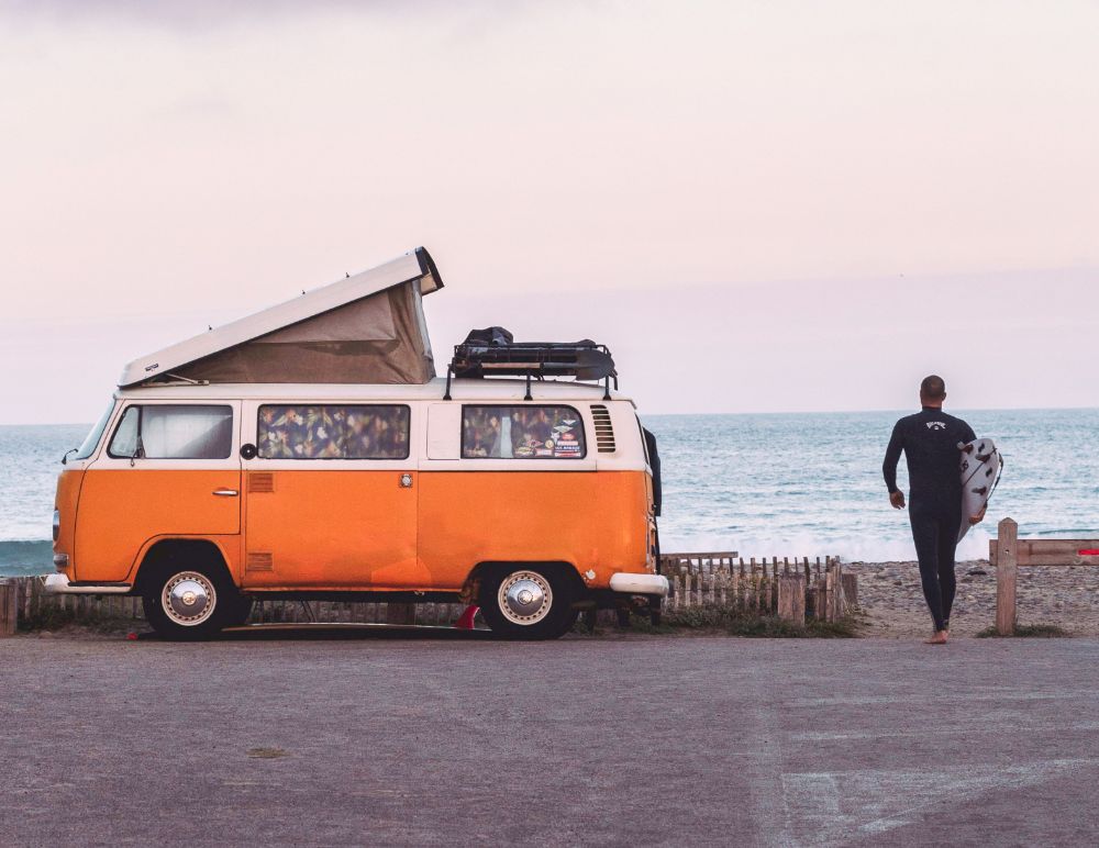 Classic VW at the beach with surf boards