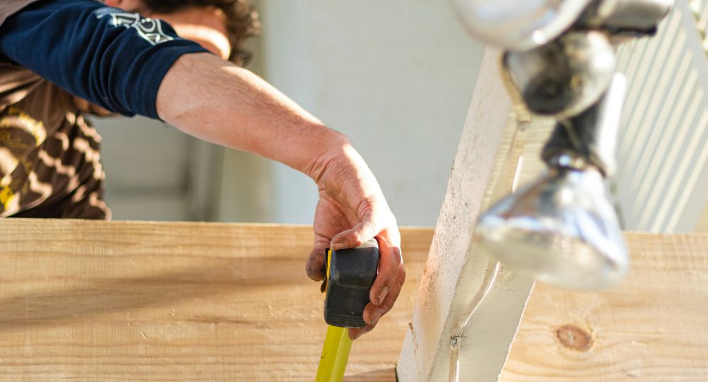 person holding tape measure
