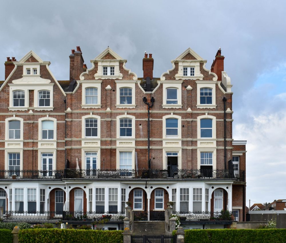 Properties with a cloudy sky in the background