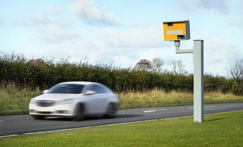 Car driving past speed camera