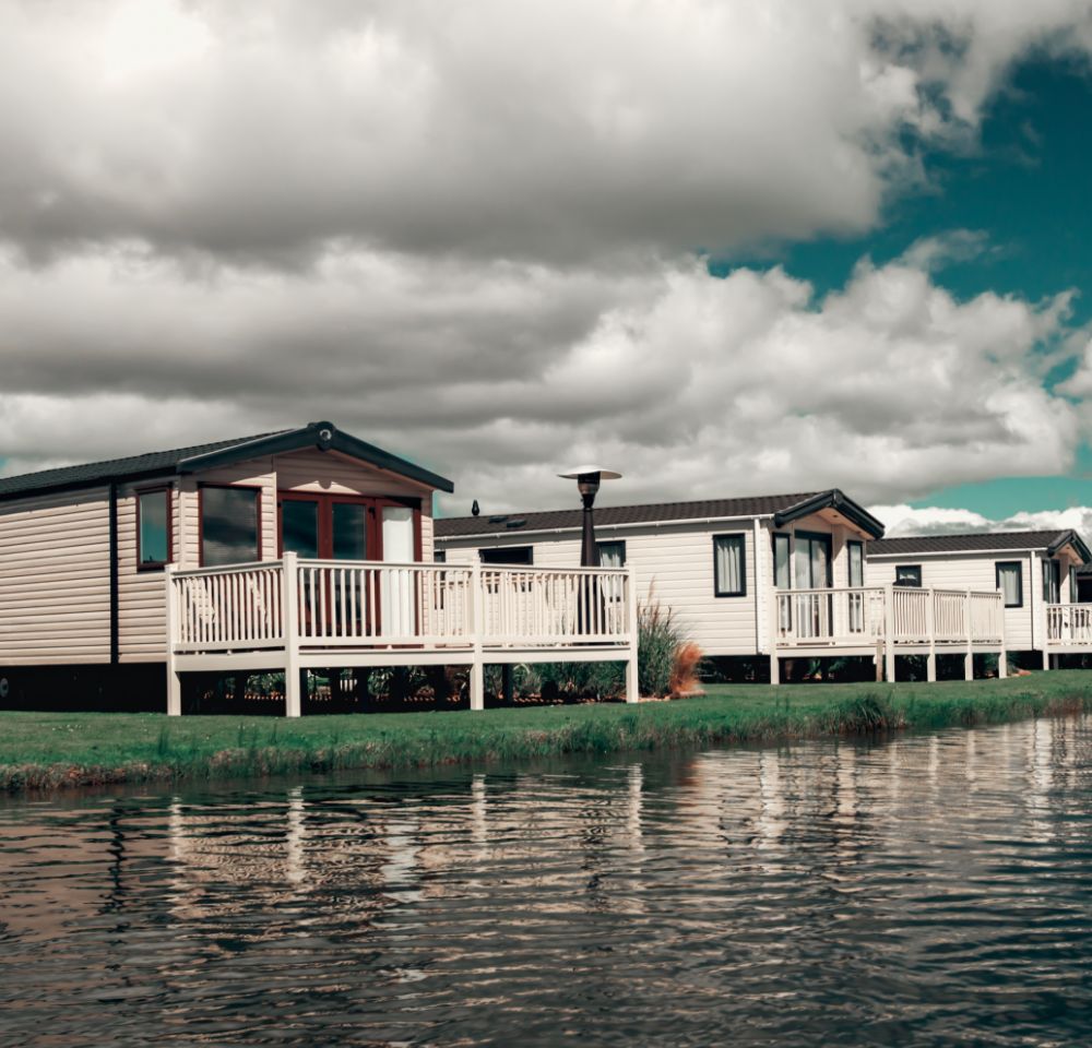 Static caravans next to a lake